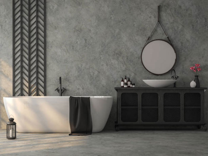 ванную комнату с бетонным полом, серыми стенами